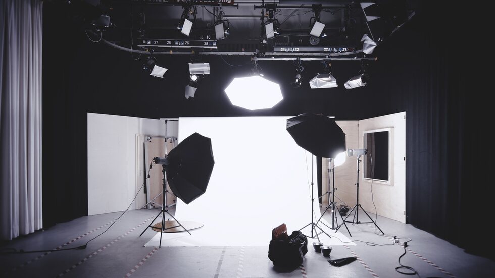 Photographer working with camera gear in a client-focused workflow